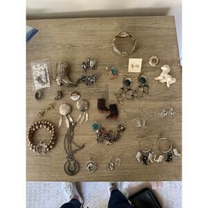 Lot of western costume jewelry.  Horse, cowboy boot etc